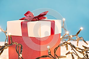 Festive Surprises: Red Gift Box and Christmas Lights