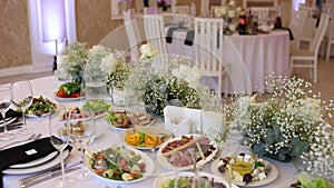 festive table with appetizers and salads on the table in the restaurant