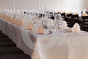 Festive table arrangement with glasses and served and cutlery