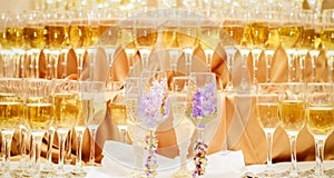 Festive table at a banquet of the wedding - champagne glasses