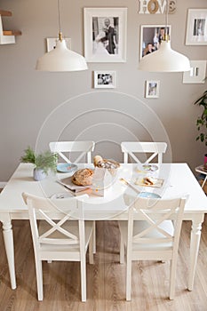 Festive table in a bright living room with fragrant homemade bread