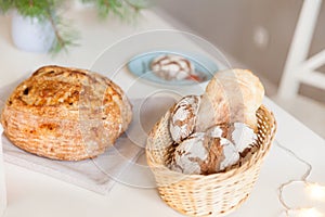 Festive table in a bright living room with fragrant homemade bread