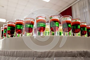 Festive table with cold exotic alcoholic beverages, cocktails.