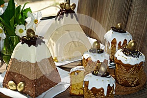 Festive table for Easter. A lot of Easter cakes from curd dough decorated with chocolate and chocolate quail eggs,