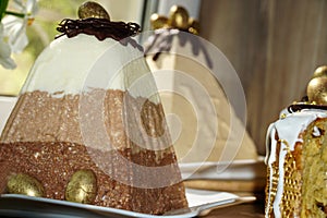 Festive table for Easter. A lot of Easter cakes from curd dough decorated with chocolate and chocolate quail eggs,