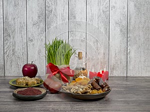 Festive table in honor of Navruz. Wheat with a red ribbon, the traditional holiday of the vernal equinox Nawruz