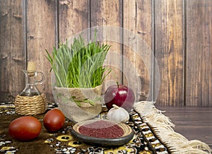 Festive table in honor of Navruz. Wheat with a red ribbon, the traditional holiday of the vernal equinox Nawruz