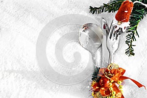 Festive table setting for christmas or new year dinner: vintage fork, spoon,knife and xmas decorations on white background with
