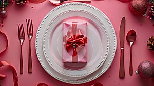 Festive Table Setting with Elegant Gift Box, Cutlery, and Christmas Decorations on a Pink Background