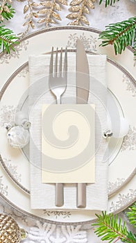 Festive table setting of with fir tree branches and Christmas decorations. Card mockup