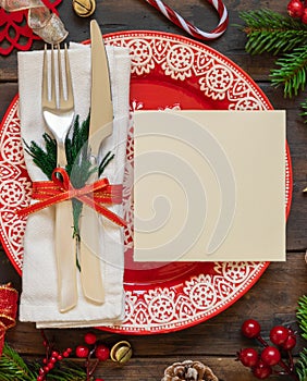 Festive table setting of with fir tree branches and Christmas decorations. Greeting card mockup