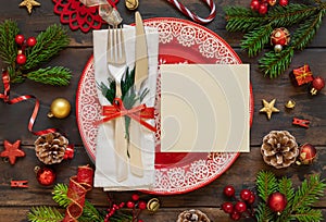 Festive table setting of with fir tree branches and Christmas decorations. Greeting card mockup