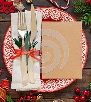 Festive table setting of with fir tree branches and Christmas decorations. Greeting card mockup
