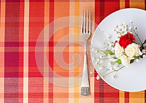 Festive table setting with flowers and vintage crockery