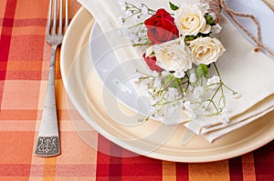 Festive table setting with flowers and vintage crockery