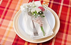 Festive table setting with flowers and vintage crockery