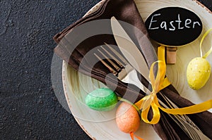 Festive table setting for holiday Easter dinner on dark table