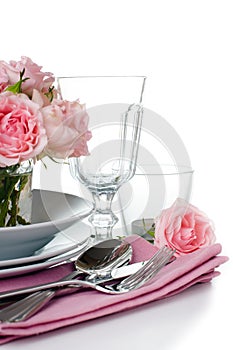 Festive table setting with pink roses