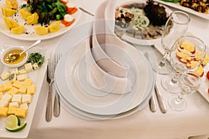 Festive table setting plate napkin wine glasses food