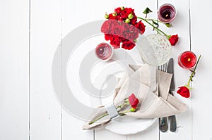 Festive table setting with red roses