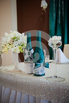 Festive table setting in the restaurant with flowers