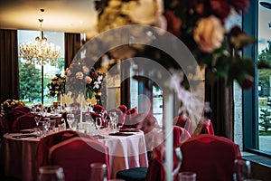 Festive table setting in the restaurant, preparation for the celebration, anniversary. Wedding Banquet, tables decorated