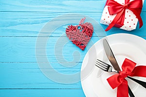 Festive table setting for Valentines Day on blue wooden background