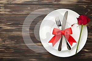 Festive table setting for Valentines Day on brown background