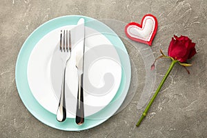 Festive table setting for Valentines Day on grey background