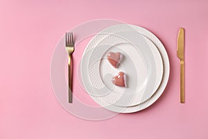 Festive table setting valentines day pink background