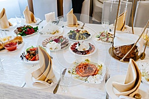 Festive table with tableware and food. Family holiday concept