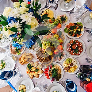 Festive table with variety of food and drinks for festive event and dinner