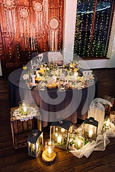 On festive table in wedding banquet. the table is decorated with compositions of greenery