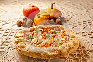 festive Thanksgiving dinner with vegetables and traditional bakery - pumpkin pie on table