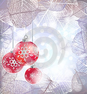 Festive winter background with red holiday balls against bokeh lights and frame of hoarfrost leaves