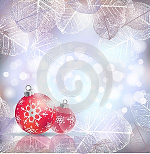 Festive winter background with red holiday balls against bokeh lights and frame of hoarfrost leaves