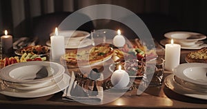 Festively decorated and beautifully served Thanksgiving table. Slider shot