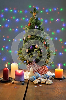 Festively decorated Christmas tree with candles and illumination