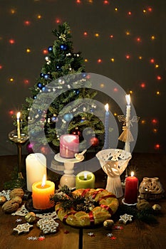 Festively decorated Christmas tree with candles and illumination