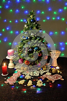 Festively decorated Christmas tree with candles and illumination