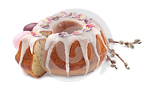 Festively decorated Easter cake, painted eggs and pussy willow branches on white background