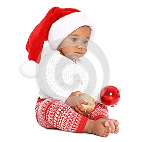 Festively dressed African-American baby with Christmas decorations on white