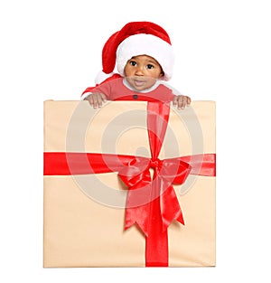 Festively dressed African-American baby in Christmas gift box