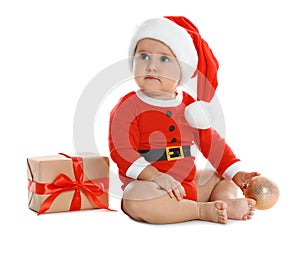 Festively dressed little baby with Christmas gift