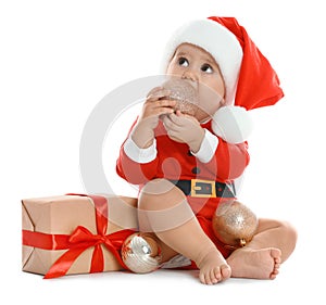 Festively dressed little baby with Christmas gift