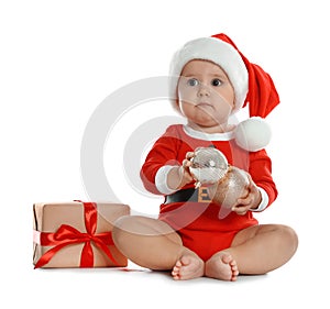 Festively dressed little baby with Christmas gift