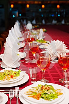 Festively served banquet table with glasses