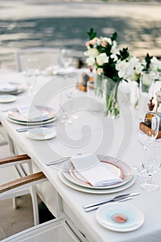 Festively served table with bouquets of flowers