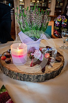 a festively set table there is an autumnal decor