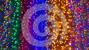 Festivity background with colored christmas lights for xmas tree